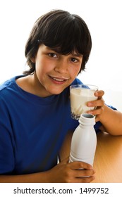 Boy With A Milk Mustache, Toasting With A Glass Of Milk