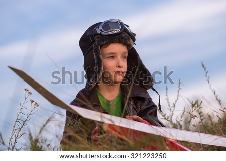 boy with a model airplane field, Young  boy pilot 
