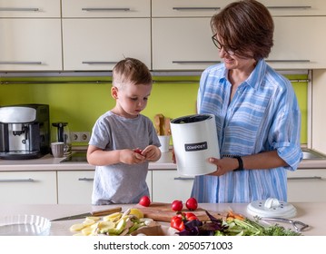 Boy and mom put food waste into the compost bin. Copy space. Waste sorting. Zero waste concept. No plastic. - Powered by Shutterstock