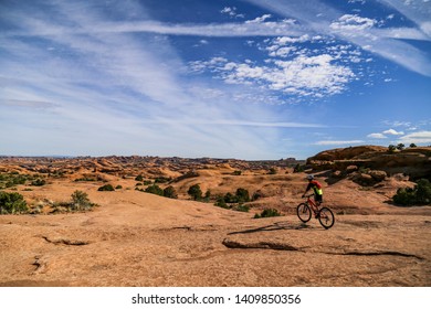 Boy Mountain Biking On Slickrock Trail In Moab, Utah