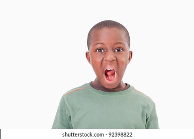 Boy With The Mouth Open Against A White Background