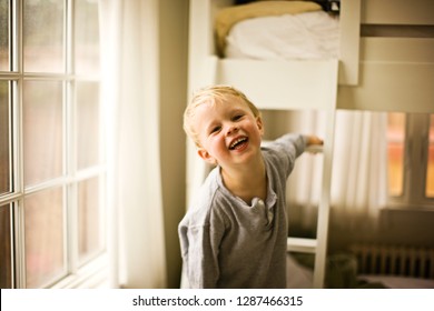 Boy Next To His Bunk Beds