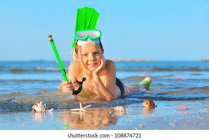 Boy On Beach With Snorkles