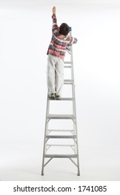 Boy On Ladder Reaching Up On White Background