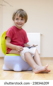 Boy On Potty Using Tablet Pc