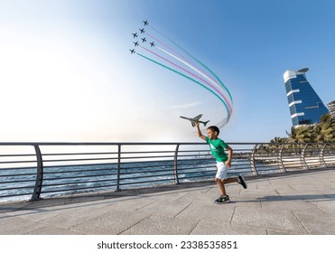 A boy on the Saudi National Day and the air show On the Jeddah Corniche