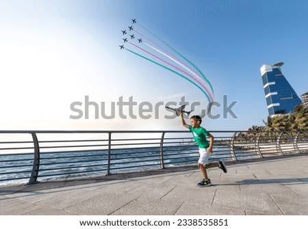 A boy on the Saudi National Day and the air show On the Jeddah Corniche