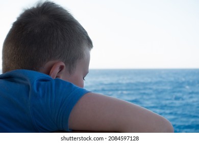 Boy On A Ship Sets Sail In The Blue Sea