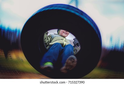 Boy On Tire Swing