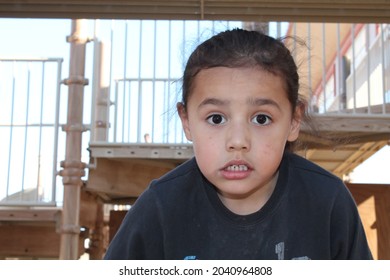 Boy Outside Playing And Exploring. Goofy Kid Faces 