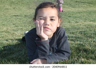 Boy Outside Playing And Exploring. Goofy Kid Faces 