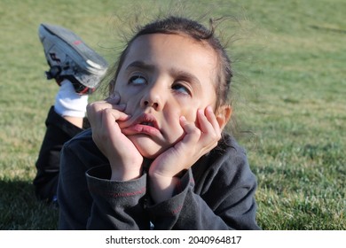 Boy Outside Playing And Exploring. Goofy Kid Faces 