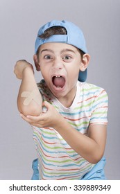 Boy In Pain With Wounded Arm