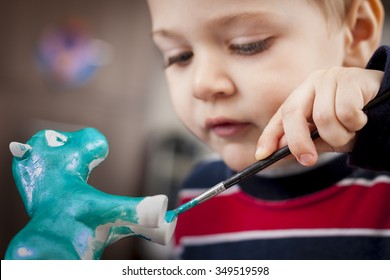 Boy Painting Ceramic Figure