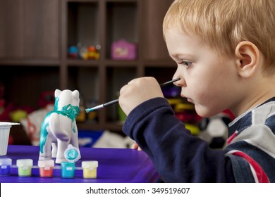 Boy Painting Ceramic Figure