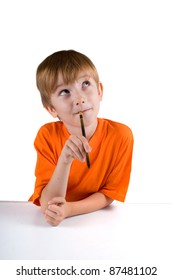 Boy with a pencil to think about something isolated on a white background