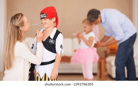 Boy, pirate costume and halloween with mother in home, face paint and happiness in childhood. Son, smile and house birthday with party clothes by woman, love family and celebration together with care - Powered by Shutterstock