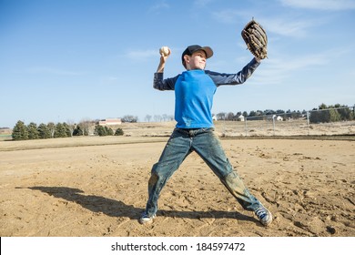 Boy pitching a baseball