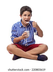  Boy With Plaid Eating A Yogurt