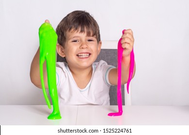 Boy Play With Slime. Kid Squeeze And Stretching Toy Slime.