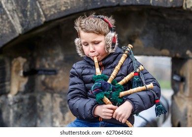 Boy Playing Bagpipe In Edinburgh Castle In Spring