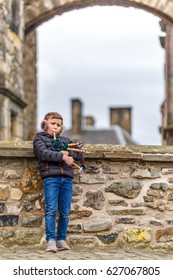 Boy Playing Bagpipe In Edinburgh Castle In Spring