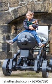 Boy Playing Bagpipe In Edinburgh Castle In Spring