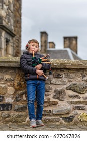 Boy Playing Bagpipe In Edinburgh Castle In Spring