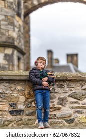 Boy Playing Bagpipe In Edinburgh Castle In Spring