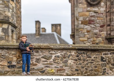 Boy Playing Bagpipe In Edinburgh Castle In Spring