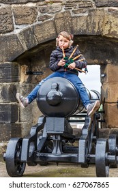 Boy Playing Bagpipe In Edinburgh Castle In Spring