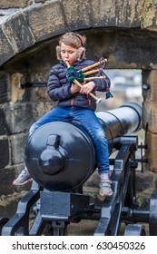 Boy Playing Bagpipe In Edinburgh Castle In Spring