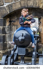 Boy Playing Bagpipe In Edinburgh In Spring