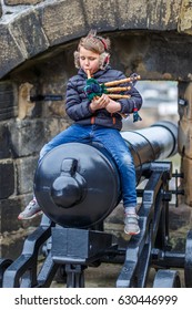 Boy Playing Bagpipe In Edinburgh In Spring