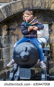 Boy Playing Bagpipe In Edinburgh In Spring