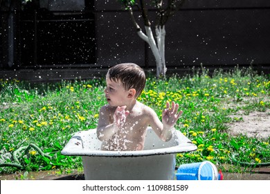 boy is playing in the bathroom outdoors