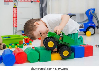 boy playing with car