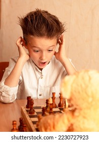 The boy playing the chess. Image with selective focus - Shutterstock ID 2230727923