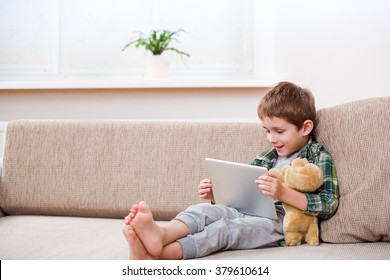 boy playing with digital tablet