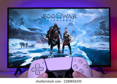 Boy playing God of War Ragnarok with Playstation 5 controller. 20 Jul, 2022, Sao Paulo, Brazil.