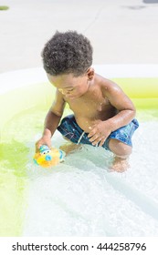 Boy Playing In Kiddie Pool