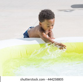 Boy Playing In Kiddie Pool