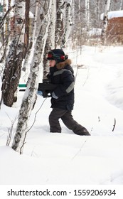 Boy Playing Laser Tag In The Woods