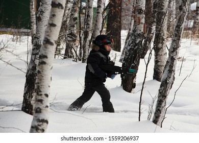 Boy Playing Laser Tag In The Woods