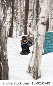 Boy Playing Laser Tag In The Woods