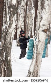 Boy Playing Laser Tag In The Woods