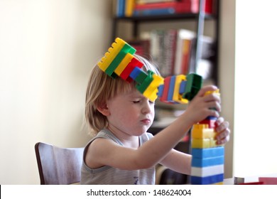 Boy Playing With Lego Cubes, Lego Falls On The Head