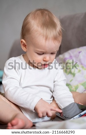boy playing with mobile phone
