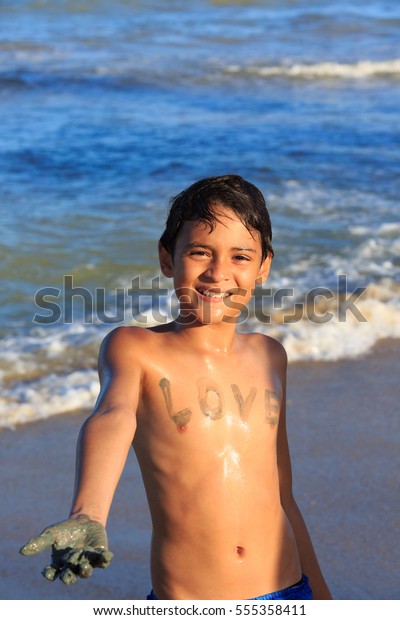 Boy Playing On Beach Body Painting Stock Photo (Edit Now) 555358411