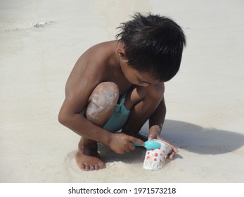 A  boy playing on the beach in Tanjung Bira, South Sulawesi, Indonesia. Photo taken on March 27, 2013.